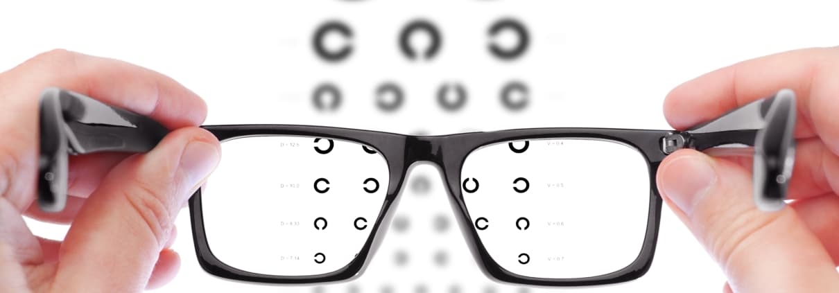 https://www.paulvisioninstitute.com/wp-content/uploads/2021/11/man-checking-vision-with-new-glasses-1210x423.jpg